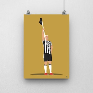 May include: A black and white striped soccer jersey with a white collar and black trim. The jersey is being held up in the air by a person wearing red shoes. The background is a solid gold color.