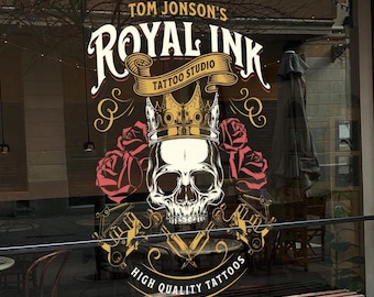 May include: A storefront window with a sign that reads "Tom Jonson's Royal Ink Tattoo Studio" with a skull and crossbones logo and the text "High Quality Tattoos".