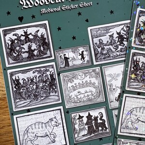 May include: A sticker sheet titled "Woodcut Witches Medieval Sticker Sheet" with various black and white illustrations of witches and medieval scenes. The stickers are on a dark green background with star and heart accents.