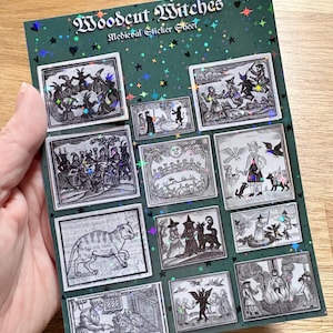 May include: A dark green sticker sheet titled Woodcut Witches Medieval Sticker Sheet featuring various black and white woodcut-style illustrations of witches, cats, and mythical figures, accented with a holographic star and heart pattern.