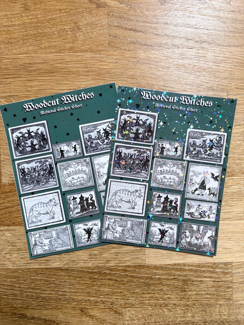May include: Two sticker sheets with the text "Woodcut Witches Medieval Sticker Sheet" on a green background. Each sheet features multiple black and white illustrations of witches and medieval scenes. One sheet has a glittery finish.
