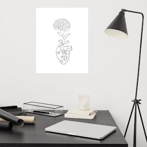 May include: A black and white line drawing of a brain growing from a heart. The image is on a white background.