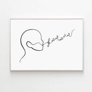 Può includere: Stampa artistica minimalista incorniciata. Il disegno a tratto nero su sfondo bianco raffigura un profilo umano con la parola "loser" in un carattere stilizzato che esce dalla bocca. La cornice è argentata.