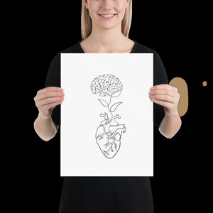 May include: A black and white line drawing of a brain growing from a heart. The brain is styled as a flower with leaves.