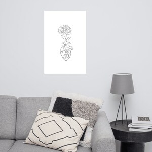 May include: Line art drawing of a human heart with a brain growing from the top, resembling a flower.