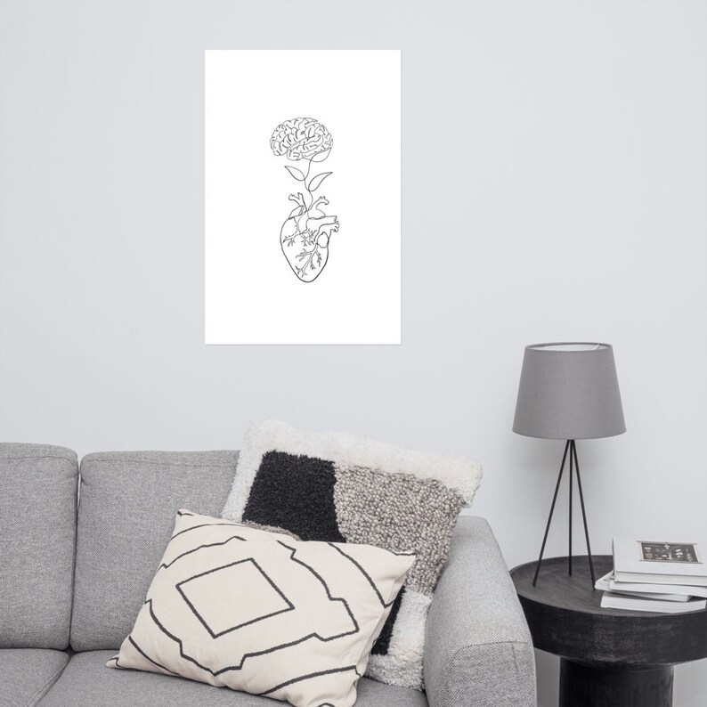 May include: Line art drawing of a human heart with a brain growing from the top, resembling a flower.