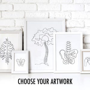 May include: A collection of framed line art prints featuring anatomical illustrations of the human body. The prints are in white frames and include images of the rib cage, spine, pelvis, and shoulder. The text "CHOOSE YOUR ARTWORK" is at the bottom.