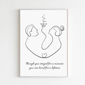 May include: A framed art print with a minimalist line drawing of two figures facing each other, linked by a butterfly and a heart. The text at the bottom reads, "Though you stayed for a moment, you are loved for a lifetime."