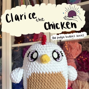 May include: A crocheted chicken amigurumi toy named Clarice, part of the "Pudgie Buddies" series. The chicken is white with a brown chest and has a red comb and yellow beak. The toy has large, black eyes with purple flower accents.