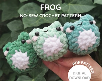 May include: Three handmade crochet frog toys in shades of green and white. The frogs have black eyes and are displayed against a background of green leaves. Text on the image reads "FROG NO-SEW CROCHET PATTERN" and "PDF PATTERN DIGITAL DOWNLOAD."