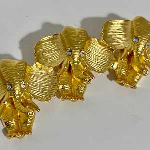 Norma Jean Designs Vintage matte gold elephant pin with crystal eyes. Made in the USA