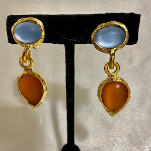 Made in USA Clip Norma Jean Designs Vintage matte gold earrings with frosted glass stones colors blue and topaz stones.