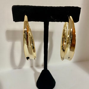 Large pierced concave gold hoops with spring back clip Norma Jean Designs Vintage earrings. Made in the USA