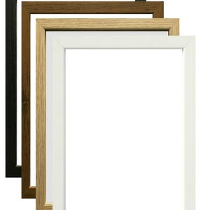 May include: Four square picture frames in black, brown, light wood, and white. The frames are stacked, showing the different colours and textures of the wood. The frames are empty, with a white background.