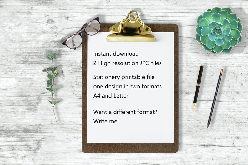 May include: A clipboard with a white sheet of paper on a wooden surface. The paper has text that reads: "Instant download, 2 High resolution JPG files, Stationery printable file, one design in two formats, A4 and Letter, Want a different format? Write me!"