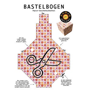 May include: A printable template for a gift box with a floral pattern. The template includes instructions for folding and cutting the paper. The box is designed to be assembled into a cube shape.