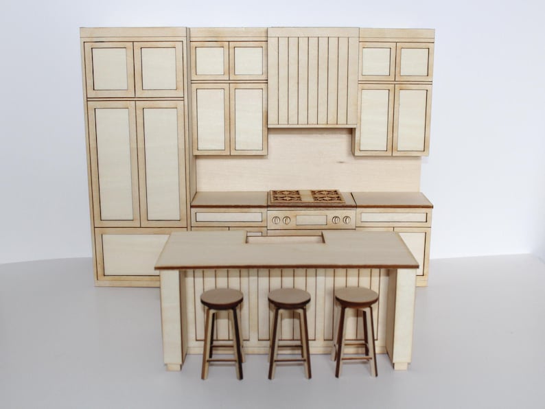 May include: A miniature wooden kitchen set with a light wood finish. The set includes cabinets, a stove, a range hood, a kitchen island, and three stools. The kitchen island is 76 cm long.