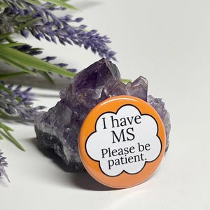 May include: Orange button with a white cloud shape and the text "I have MS Please be patient."