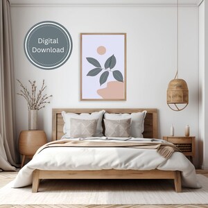 May include: A digital download of a minimalist art print featuring a stylized branch with leaves in shades of blue and green against a light pink background with a circle in the upper right corner.