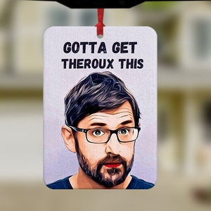 May include: White car air freshener with a red string hanging from the rearview mirror. The air freshener has a picture of a man with a beard and glasses and the text "GOTTA GET THEROX THIS".