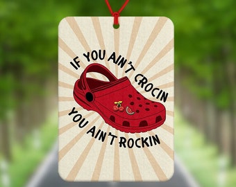 May include: Red and white car air freshener with a red and white Croc shoe and the text "If you ain't crocin you ain't rockin".