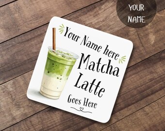 May include: Square white coaster featuring a matcha latte illustration in a clear cup with a brown straw. The coaster has the text "Your Name here Matcha Latte Goes Here" in black, with a small heart. A circle in the top right corner says "Add Your Name".