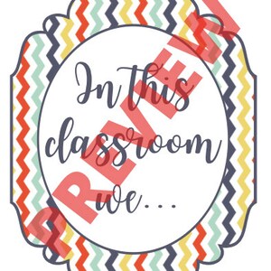 May include: A decorative sign with a white center and a colorful chevron border in red, yellow, blue, and green. The sign reads "In this classroom we..." in a cursive font.