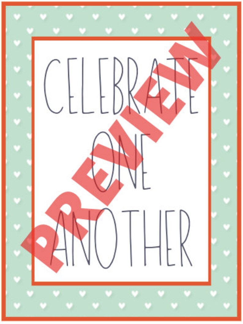 May include: A rectangular print with the words "CELEBRATE ONE ANOTHER" in a dark blue font. The print has a white background with a red border. The background has a light green color with white hearts.