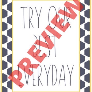 May include: A white rectangular sign with the words "TRY OUR BEST EVERYDAY" in black, surrounded by a geometric pattern of navy blue hexagons and a yellow border.