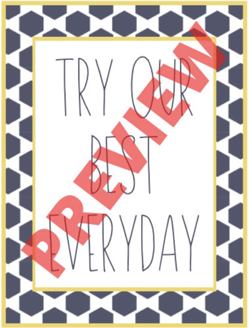 May include: A white rectangular sign with the words "TRY OUR BEST EVERYDAY" in black, surrounded by a geometric pattern of navy blue hexagons and a yellow border.