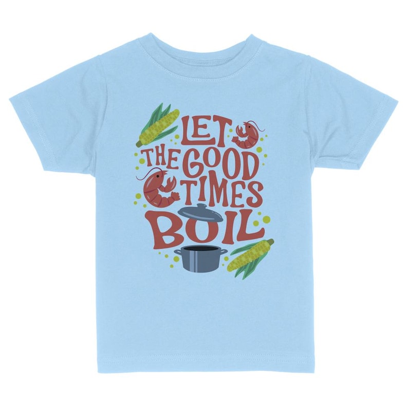 May include: Light blue t-shirt with a graphic design of a pot, corn, and crawfish with the text "Let the good times boil."