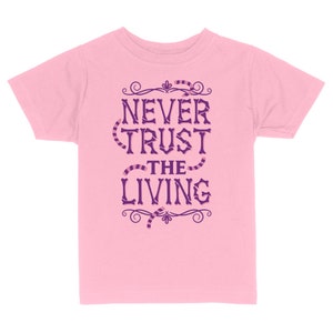 Never Trust The Living Toddler & Kids Youth T-Shirt, Kids Halloween Tees, Funny Halloween Shirts Light Pink
