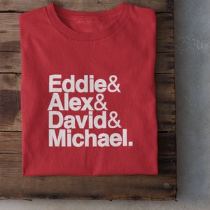 May include: Red t-shirt with white text that reads "Eddie & Alex & David & Michael."
