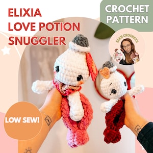 May include: Two handmade crochet dolls, the "Elixia Love Potion Snuggler", are displayed. The dolls are white with pink and red accents, wearing tiny hats and scarves. The image includes text that says "Crochet Pattern" and "Low Sew!"