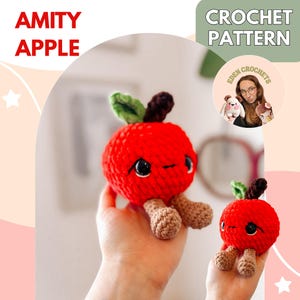 Puede incluir: Dos juguetes de manzana roja de ganchillo con ojos negros, hojas verdes y tallos y patas marrones. El texto "AMITY APPLE" y "CROCHET PATTERN" son visibles. También se ve el logotipo de "EDEN CROCHETS".