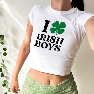 May include: White crop top with a green shamrock and the text "I love Irish Boys".