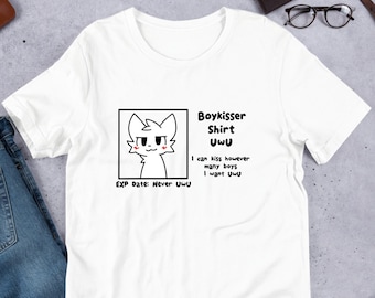 May include: White t-shirt featuring a black and white illustration of a cartoon cat with red cheeks. The text "Boykisser Shirt UwU" is above the cat and the text "EXP Date: Never UwU" is below the cat. The text "I can kiss however many boys I want UwU" is to the right of the cat.