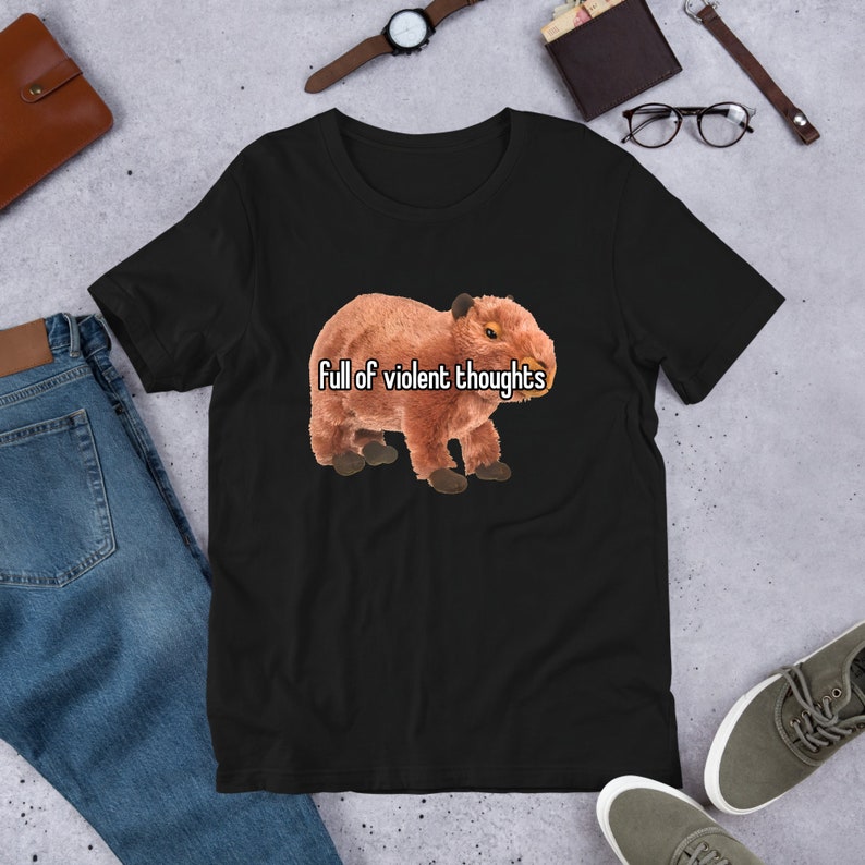 May include: Black t-shirt with a brown capybara illustration and the text "full of violent thoughts" printed on the front.