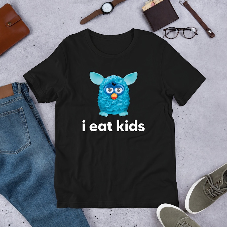 May include: Black t-shirt with a blue fuzzy creature and the text "i eat kids" printed on it.