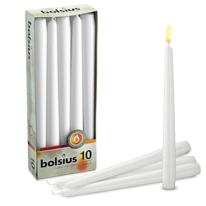 May include: A box of 10 white tapered candles by Bolsius. The box has a red, orange, and yellow design with the text "Bolsius Colour your home" and "Tapered Candles".