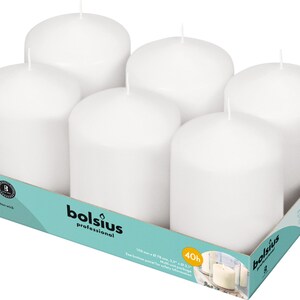 May include: A set of six white pillar candles in a box. The candles are 100 mm (3.9 inches) in diameter and 78 mm (3.1 inches) tall. The box says "Bolsius Professional" and "40h".