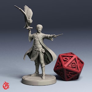 May include: A light gray miniature figurine of a young wizard wearing glasses and a long coat, holding a wand in one hand and a perched owl in the other. Beside the figure stands a large, red twenty-sided die with clearly visible numbers.