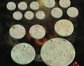 May include: A collection of thirteen circular miniature bases of varying sizes, each featuring a textured forest floor surface with scattered fallen leaves, twigs, and small winding root-like structures in shades of green, brown, and beige.