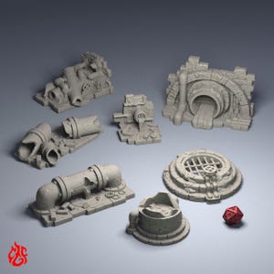 May include: A selection of grey miniature terrain pieces, including pipes, a sewer entrance, and a manhole cover. A red twenty-sided die is also present. These pieces are likely for tabletop gaming.