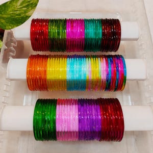 May include: A set of three ceramic mugs with a speckled, matte finish. The mugs are in shades of cream, light gray, and dark gray. Each mug has a simple, minimalist design, perfect for coffee or tea.