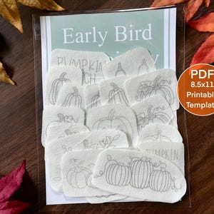May include: A collection of white fabric patches featuring grey line art illustrations of various pumpkins. The patches are packaged in a clear sleeve with a header card labelled Early Bird and a circular orange sticker stating PDF 8.5x11 Printable Template.