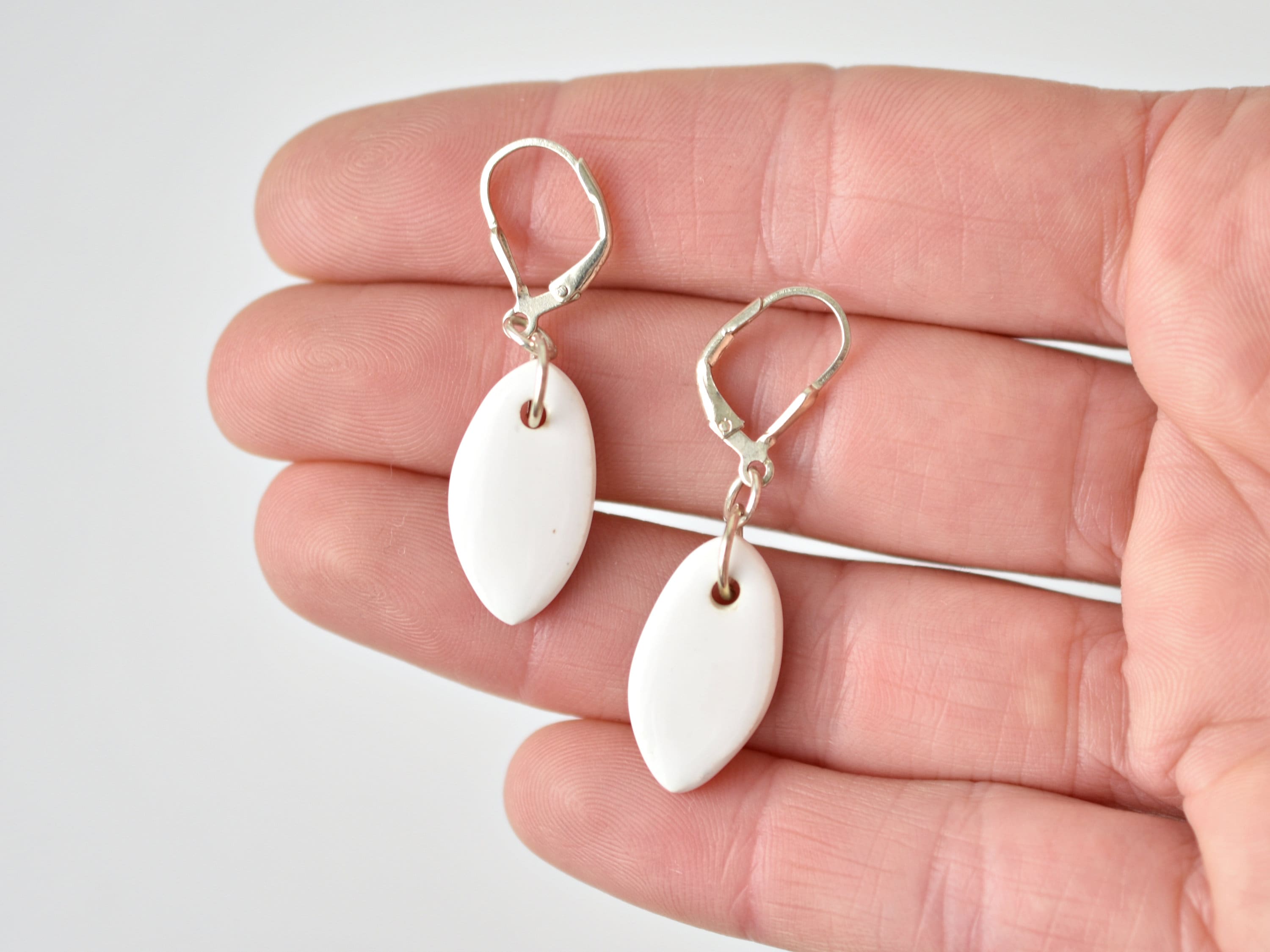 Lulip | Handcrafted white ceramic dangle earrings main image 1
