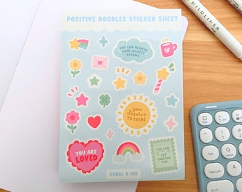 May include: A sticker sheet with a light blue background featuring positive affirmations and cute illustrations. The stickers include phrases like "You Can Achieve Your Wildest Dreams", "You Deserve To Shine", "You Are Loved", and "You Can Get Through This". The sheet also includes illustrations of stars, flowers, hearts, rainbows, and a cup of coffee.