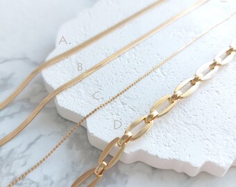 May include: Four gold chains of different styles and thicknesses laid out on a white surface. The chains are labeled A, B, C, and D. The text "JEMCOAST" is visible at the bottom of the image.