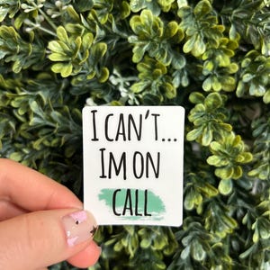 May include: White sticker with black text that reads "I can't... I'm on call" with a green brushstroke behind the word "call".